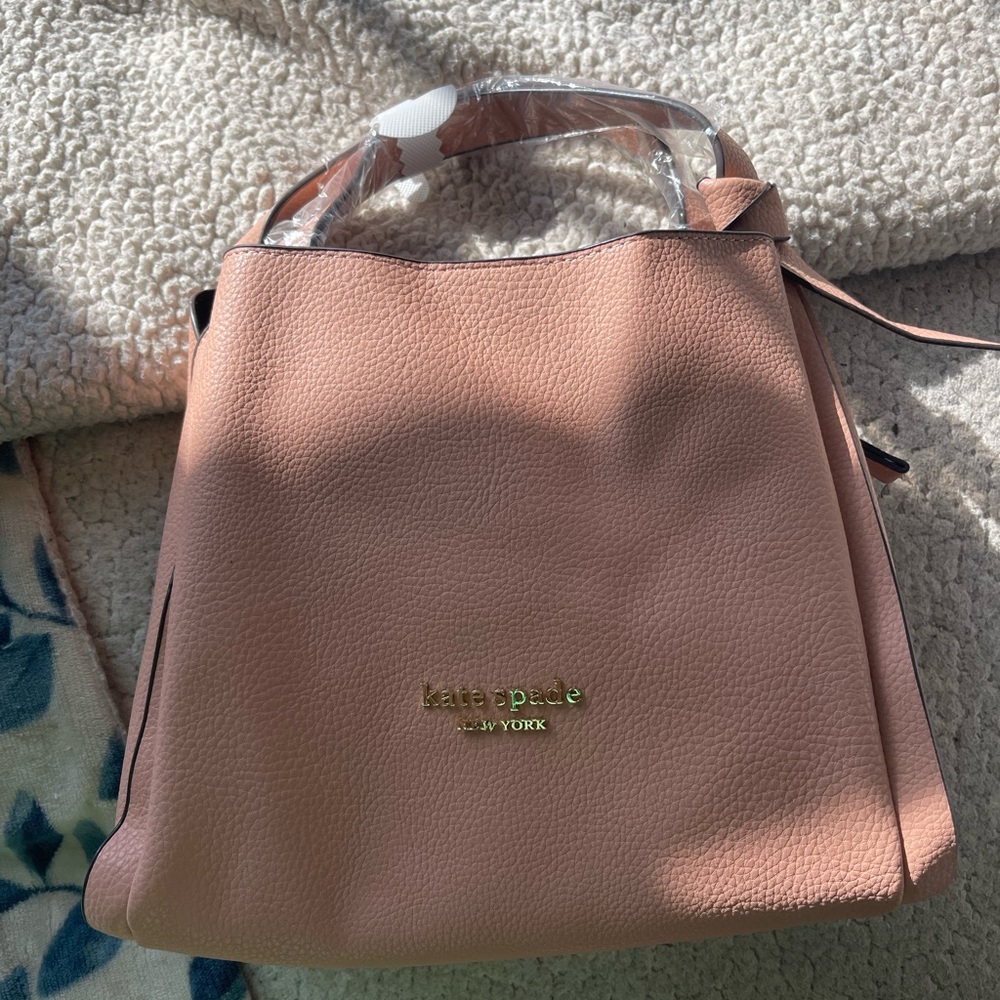 - Kate Spade top handle bag with detachable cross body strap. Includes dus…